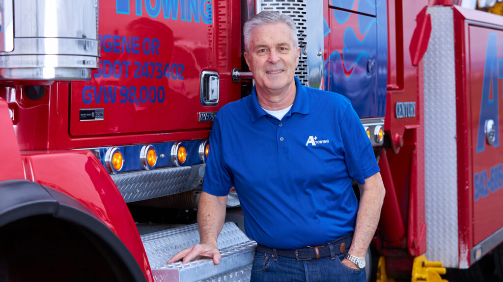 Business owner standing in front of truck