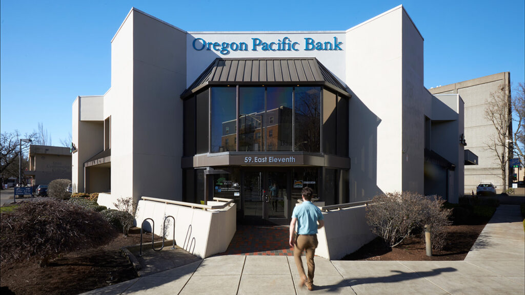 Visitor walking in to Oregon Pacific Bank's Eugene Branch.