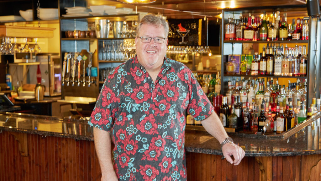 Business owner standing in his restaurant