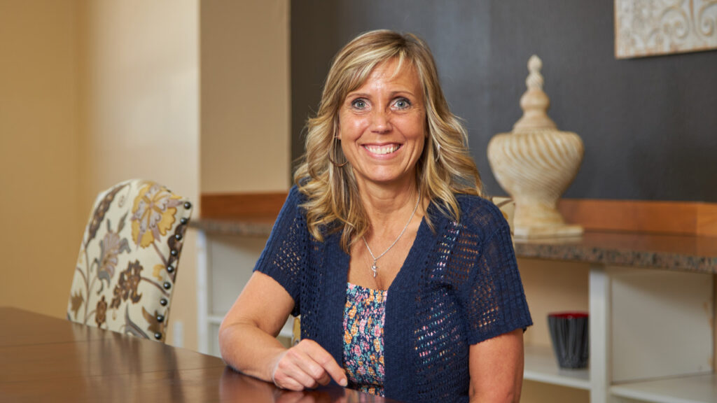 Business president smiling in her office.